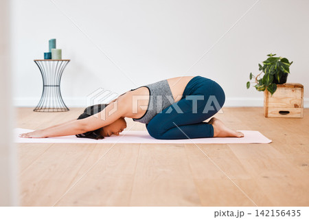 Spine, yoga or woman in home for stretching, wellness or body flexibility in zen studio for peace. Calm, child pose or female person on mat for mindfulness, meditation or balance in pilates warm up 142156435