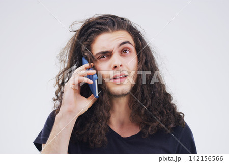 Man, confused and smartphone talking on call in studio for conversation, information and communication. Male person, mobile or tech listening for network, contact and connection on white background Man, confused and smartphone talking on call in studio for conversation, information and communication. Male person, mobile or tech listening for network, contact and connection on white background 142156566