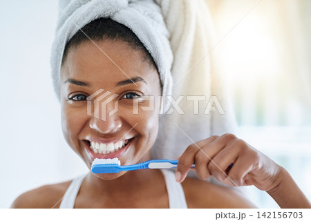 Black girl, portrait and toothbrush for oral health in bathroom, morning and dental cleaning. Happy female person, healthcare and hygiene treatment in home, brushing and orthodontics for cosmetics Black girl, portrait and toothbrush for oral health in bathroom, morning and dental cleaning. Happy female person, healthcare and hygiene treatment in home, brushing and orthodontics for cosmetics 142156703