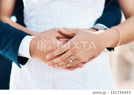 Couple, hug and wedding ring in outdoors, love and symbol for promise of loyalty or commitment. People, hands and embrace or icon for partnership, support and trust in marriage or relationship Couple, hug and wedding ring in outdoors, love and symbol for promise of loyalty or commitment. People, hands and embrace or icon for partnership, support and trust in marriage or relationship 142156843