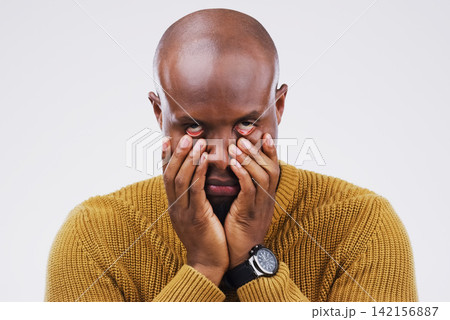 Portrait, black man and frustrated in studio with eye roll for stress, frustration and burnout. African male person, annoyed and hands on face for tension, anxiety and crazy mood by white background Portrait, black man and frustrated in studio with eye roll for stress, frustration and burnout. African male person, annoyed and hands on face for tension, anxiety and crazy mood by white background 142156887