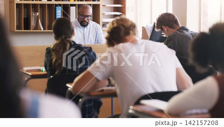 Students, test and exam with writing, education and support for study and knowledge. Man, teenager and classroom with learning, teacher and high school development for future growth for question Students, test and exam with writing, education and support for study and knowledge. Man, teenager and classroom with learning, teacher and high school development for future growth for question 142157208