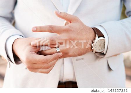 Man, groom and wedding ring in outdoors, jewelry and symbol for promise of loyalty or commitment. Male person, fingers and icon for love or partnership, support and trust in marriage or relationship Man, groom and wedding ring in outdoors, jewelry and symbol for promise of loyalty or commitment. Male person, fingers and icon for love or partnership, support and trust in marriage or relationship 142157821