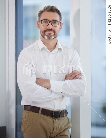 Business man, arms crossed and portrait in the morning with job, smile and confidence at creative company. Manager, office and creative director at a journalism agency with a mature leader and proud 142158326