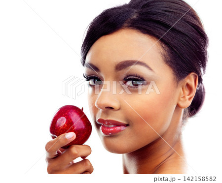 Beauty, apple and portrait of woman in studio with organic, fresh and natural snack for face. Cosmetic, glow and female person with fruit for facial cosmetology routine isolated by white background 142158582