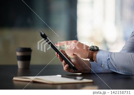 Businessman, tablet and hands in office typing for communication, corporate research and blog post. Male person, tech or notebook on desk working on online plan for website, social media or sales 142158731