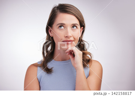 Face, idea and thinking with woman problem solving in studio on gray background for inspiration. Future, planning and vision with confused person looking up for opportunity, solution or question Face, idea and thinking with woman problem solving in studio on gray background for inspiration. Future, planning and vision with confused person looking up for opportunity, solution or question 142158817