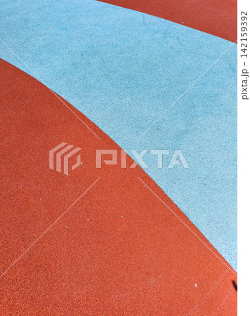 Colorful playground surface at a park during the day Colorful playground surface at a park during the day 142159392