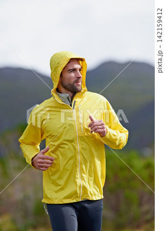 Running, rain and man with exercise, training and endurance with progress and dedication with nature. Wet, runner and athlete with cardio and wellness with wind and breathing with fitness and workout Running, rain and man with exercise, training and endurance with progress and dedication with nature. Wet, runner and athlete with cardio and wellness with wind and breathing with fitness and workout 142159412