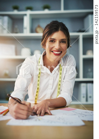 Portrait, happy girl or pencil in fashion design, business or workshop as creative entrepreneur. Smile, seamstress or tape measure at table, sketch or sewing machine as textile trending style Portrait, happy girl or pencil in fashion design, business or workshop as creative entrepreneur. Smile, seamstress or tape measure at table, sketch or sewing machine as textile trending style 142159573