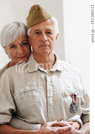 Military, old man and woman with veteran in uniform with medal or pride for memory of battle service. Elderly couple, army or retirement from duty to government with support, care or hug from partner Military, old man and woman with veteran in uniform with medal or pride for memory of battle service. Elderly couple, army or retirement from duty to government with support, care or hug from partner 142160311