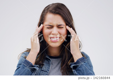 Woman, headache and pain in studio, stress and burnout or anxiety for mental health on gray background. Female person, worry and sad for fail or mistake, migraine and distress on mockup space or ill Woman, headache and pain in studio, stress and burnout or anxiety for mental health on gray background. Female person, worry and sad for fail or mistake, migraine and distress on mockup space or ill 142160844