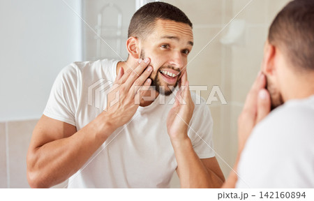 Skincare, mirror and man in house with hands on face for beard, inspection or facial hair growth. Beauty, reflection and person with skin check in bathroom for cleaning, dermatology and self care Skincare, mirror and man in house with hands on face for beard, inspection or facial hair growth. Beauty, reflection and person with skin check in bathroom for cleaning, dermatology and self care 142160894