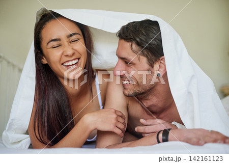 Happy woman, couple and intimacy on bed for commitment, trust and love in home or apartment. Man, comfort and relationship with pride for marriage, bond and smile with partner for anniversary or date 142161123