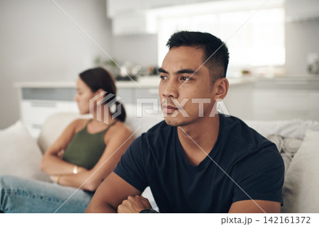 Frustrated couple, ignore and fight with argument on sofa for breakup, conflict or disagreement in living room at home. Upset or young woman and man in divorce, separation or dispute at the house Frustrated couple, ignore and fight with argument on sofa for breakup, conflict or disagreement in living room at home. Upset or young woman and man in divorce, separation or dispute at the house 142161372