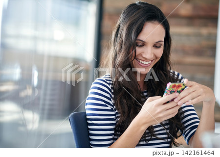 Happy woman, office and typing with phone for communication, social media or connection. Young female person or employee with smile on mobile smartphone for online chatting or texting at workplace 142161464