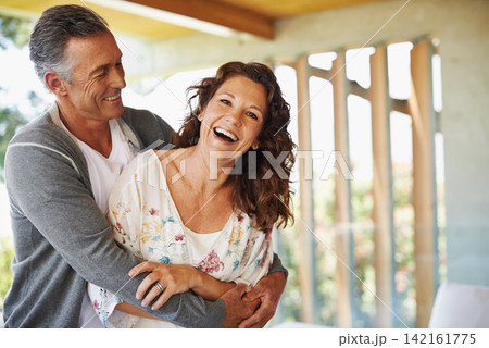 Laughing, portrait or mature couple hug in home for support, wellness or love for care, marriage or trust. Smile, fun or happy woman bonding with man in retirement, break or house to relax together Laughing, portrait or mature couple hug in home for support, wellness or love for care, marriage or trust. Smile, fun or happy woman bonding with man in retirement, break or house to relax together 142161775