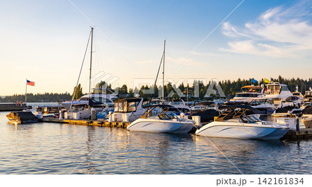 Yacht in boat harbor. Private luxury yacht for best summer vacation. Summer boat vacation. Boat yachting. Yacht vacation in summer. Marina bay. A luxury motor yacht in sea marina bay. Boat docking 142161834
