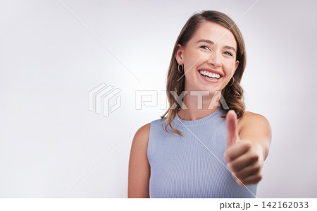 Thumbs up, agreement and portrait of happy woman in studio mockup with positive attitude. Thank you, smile and girl with yes hand gesture for success emoji, praise and achievement on white background Thumbs up, agreement and portrait of happy woman in studio mockup with positive attitude. Thank you, smile and girl with yes hand gesture for success emoji, praise and achievement on white background 142162033