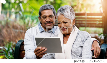 Park, bench and senior couple with tablet for social media, smile and connection with internet. Relax, mature and woman in garden with digital app for reading, post or online memory with nostalgia Park, bench and senior couple with tablet for social media, smile and connection with internet. Relax, mature and woman in garden with digital app for reading, post or online memory with nostalgia 142162752