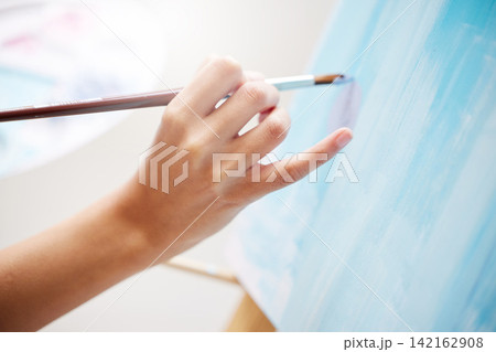 Hands, artist and paint with brush on canvas for art with passion or talent for design of masterpiece. Professional, inspiration and skill on easel with creativity to create picture for exhibition 142162908