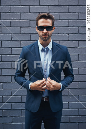 Businessman, bricks and trendy with suit and confident for fashion, clothing or clothes and cool. Male lawyer, backdrop and stylish or edgy for career with corporate, funky with sunglasses in Seattle Businessman, bricks and trendy with suit and confident for fashion, clothing or clothes and cool. Male lawyer, backdrop and stylish or edgy for career with corporate, funky with sunglasses in Seattle 142163268