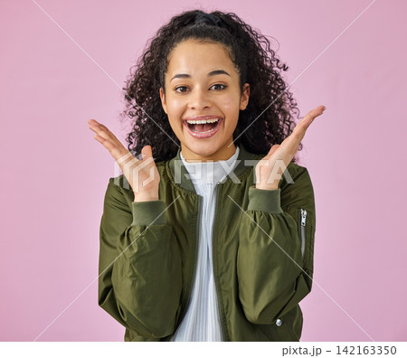 Portrait, wow and smile with woman on pink background in studio for reaction to good news. Emoji, hands and omg surprise with happy person in celebration for announcement of promotion or success 142163350