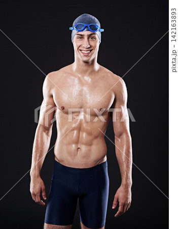 Man, studio and portrait for swimmer fitness, workout and exercise with athlete for cardio health. Wellness, confident and male person with swimming cap and goggles, black background for sport Man, studio and portrait for swimmer fitness, workout and exercise with athlete for cardio health. Wellness, confident and male person with swimming cap and goggles, black background for sport 142163893