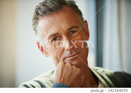 Portrait, senior man and smile in home to relax for retirement, pensioner or rest on weekend. Male person, calm and sitting on sofa in living room for break with wisdom, confidence and optimism Portrait, senior man and smile in home to relax for retirement, pensioner or rest on weekend. Male person, calm and sitting on sofa in living room for break with wisdom, confidence and optimism 142164070