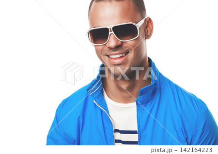 Man, happy and studio fashion with sunglasses, model and summer eyewear with confident male person. White background, stylish and trendy with face accessory, isolated and wearing eye care with smile Man, happy and studio fashion with sunglasses, model and summer eyewear with confident male person. White background, stylish and trendy with face accessory, isolated and wearing eye care with smile 142164223