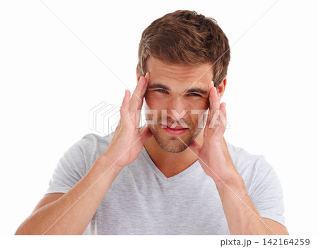 Headache, pain and portrait of man on a white background with stress, anxiety and worry for problem. Health, fatigue and isolated person massage temple for burnout, frustrated and migraine in studio Headache, pain and portrait of man on a white background with stress, anxiety and worry for problem. Health, fatigue and isolated person massage temple for burnout, frustrated and migraine in studio 142164259