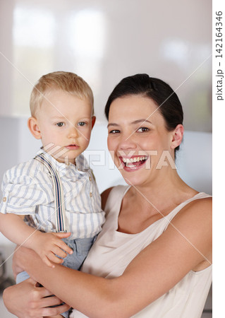 Woman, child and portrait in house with smile, development and happiness for love, youth and care indoor. Mother, young boy or holding kid and happy for bonding together, family and cute on weekend 142164346