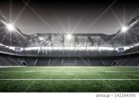 Football Stadium Glowing Under Stadium Lights Football Stadium Glowing Under Stadium Lights 142164350