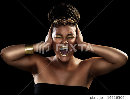 Noise, scream and black woman with gold jewelry for fashion, beauty or makeup crown for luxury isolated on dark background. African queen, expression or accessories for culture, wealth or cosmetics Noise, scream and black woman with gold jewelry for fashion, beauty or makeup crown for luxury isolated on dark background. African queen, expression or accessories for culture, wealth or cosmetics 142165064