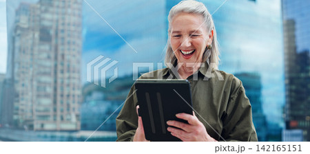 Senior, woman and laughing with tablet for business outdoor in city with corporate meme or social media joke. Elderly, entrepreneur and comedy with technology for internet scroll or funny web search 142165151