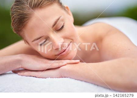 Massage, woman and spa for detox, wellness and relaxation in muscles, back and neck for self care. Female person, physical therapy and health for body with smile, calm and happiness on holiday Massage, woman and spa for detox, wellness and relaxation in muscles, back and neck for self care. Female person, physical therapy and health for body with smile, calm and happiness on holiday 142165279