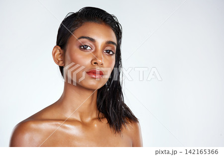 Portrait, makeup and beauty of Indian woman in studio for wellness isolated on a white background mockup space. Face, cosmetics and skincare of serious model for dermatology, shine or glow for health Portrait, makeup and beauty of Indian woman in studio for wellness isolated on a white background mockup space. Face, cosmetics and skincare of serious model for dermatology, shine or glow for health 142165366