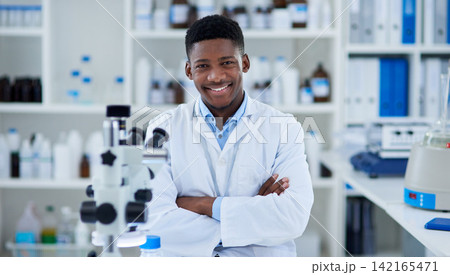 Science, man and portrait in lab with arms crossed for medical research, microscopic experiment or DNA testing. Scientist, african expert and confidence for gene editing and healthcare breakthrough 142165471
