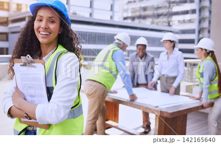 Woman, portrait and engineer with team, planning and smile for building with clipboard. Architect, construction and safety helmet for collaboration, teamwork and affirmative action in industrial job Woman, portrait and engineer with team, planning and smile for building with clipboard. Architect, construction and safety helmet for collaboration, teamwork and affirmative action in industrial job 142165640