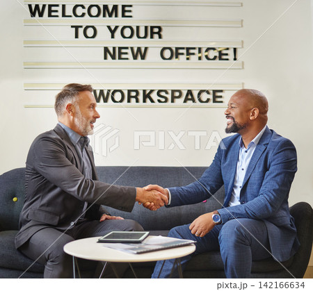 Businessman, handshake and interview with executive at office for partnership, agreement or deal. Man or employee shaking hands with CEO in meeting for hiring, recruiting or b2b on sofa at workplace 142166634