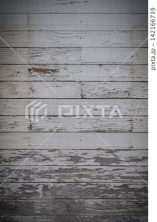 Weathered wooden floor showcasing texture and character in a rustic setting Weathered wooden floor showcasing texture and character in a rustic setting 142166739