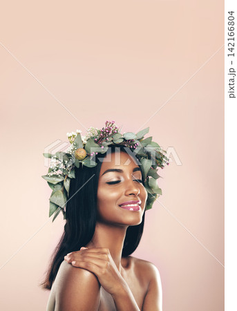 Crown, flower and natural with beauty of Indian woman in studio isolated on pink background for cosmetics. Aesthetic, eyes closed and goddess of happy young model at salon or spa makeup for wreath Crown, flower and natural with beauty of Indian woman in studio isolated on pink background for cosmetics. Aesthetic, eyes closed and goddess of happy young model at salon or spa makeup for wreath 142166804