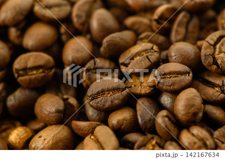 Close-Up Texture of Roasted Coffee Beans Background 142167634
