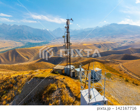 Aerial View of Communication Tower on Arid Hilltop 142167716