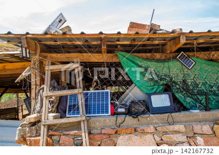 Portable solar power setup with electronics under shelter Portable solar power setup with electronics under shelter 142167732
