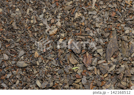 Close-up display of fragmented slate chips and fine rock shards 142168512
