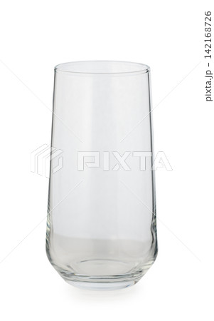 Elegant clear glass tumbler standing tall, ready to hold refreshing beverages for any occasion 142168726