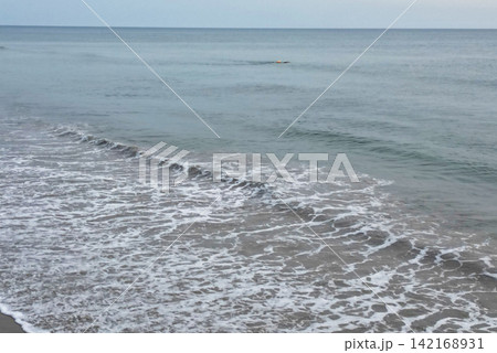 Drone View of Corolla Beach With a Swimmer in the Ocean During Vacation Drone View of Corolla Beach With a Swimmer in the Ocean During Vacation 142168931