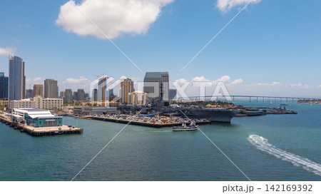 San Diego, California, USA - May 17, 2019: Aircraft carrier navy ship at sea bay. Midway aircraft carrier museum of USA naval. Military ship. USS Midway aircraft carrier museum, United States Navy San Diego, California, USA - May 17, 2019: Aircraft carrier navy ship at sea bay. Midway aircraft carrier museum of USA naval. Military ship. USS Midway aircraft carrier museum, United States Navy 142169392