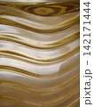 Golden abstract wavy glass pattern background texture 142171444